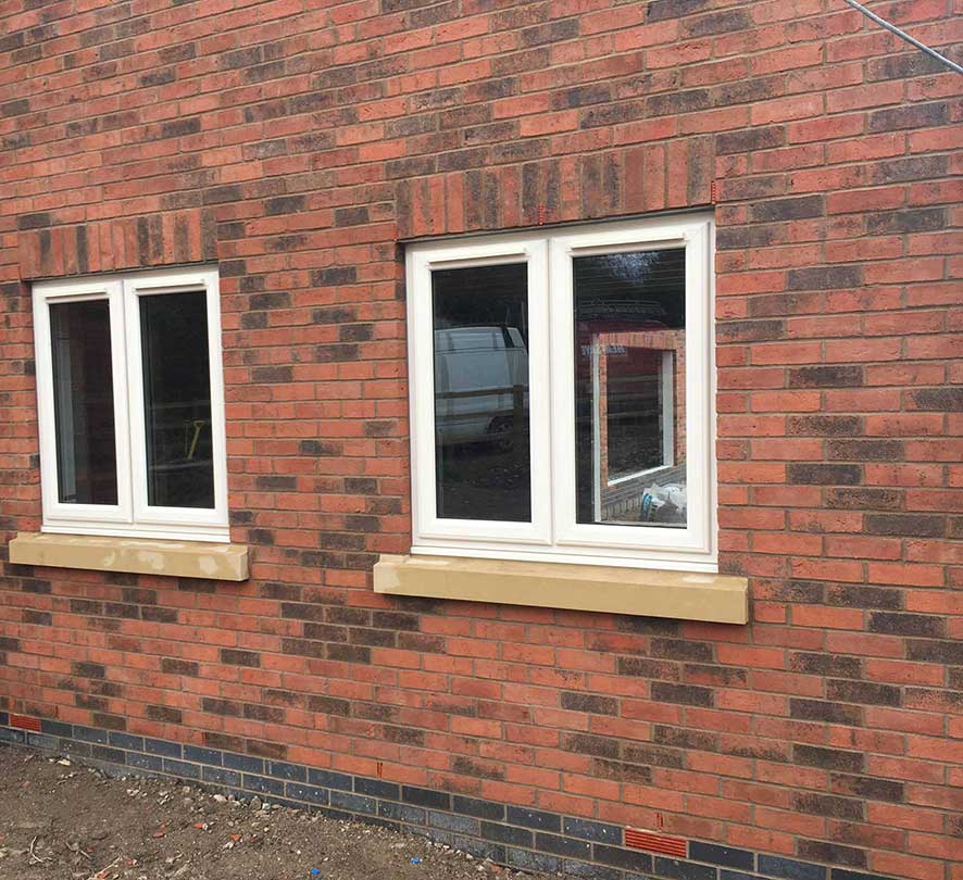 two double white framed windows