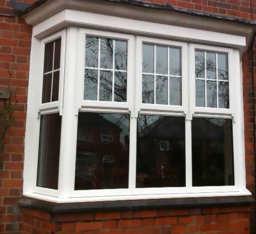 white framed windows with double cross